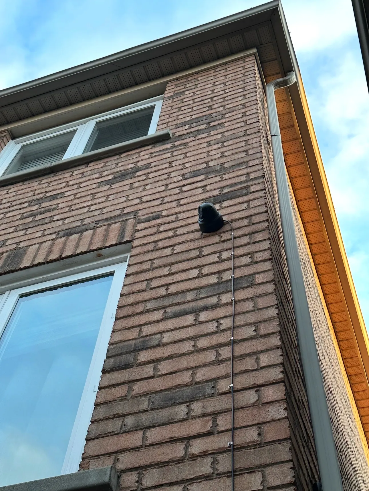 Exterior wall-mounted PTZ camera